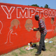 Street artist Stephen Doe paints an educational mural to inform people about the symptoms of the deadly Ebola virus in the Liberian capital, Monrovia, on Sept. 8, 2014.
Domonique Faget/Getty Images